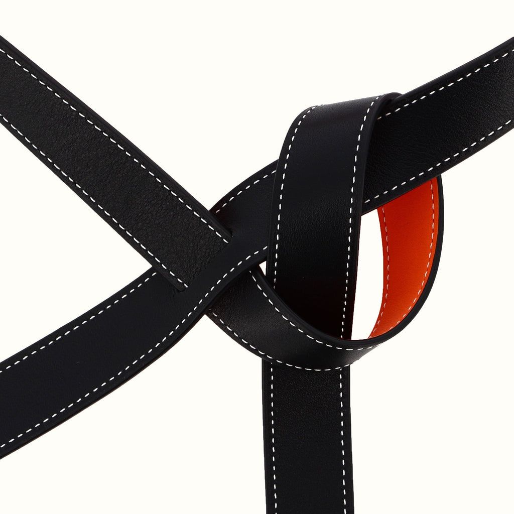 ceinture-phi-fine-bicolore-reversible-orange-noir-cuir-finition-sellier-boucle-fabrication-francaise-haute-maroquinerie-artisanat-nombre-dor